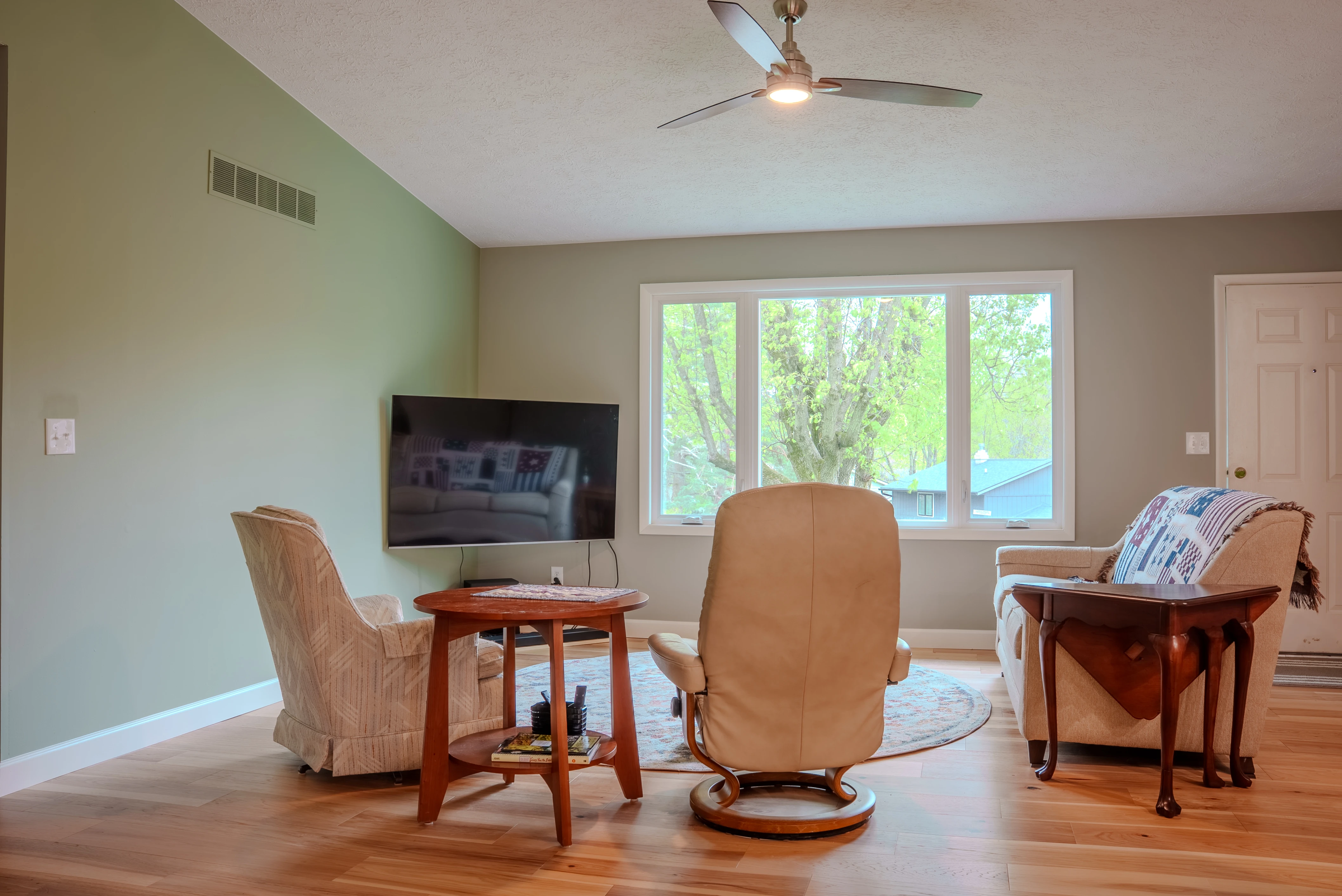 Beautiful modern kitchen remodel with white cabinets and quartz countertops in Bloomington, IN